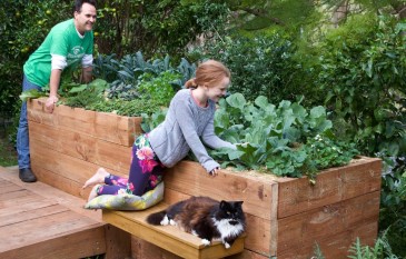 What are the advantages of using a raised garden bed?