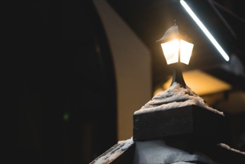 Solar outlet coach lamp